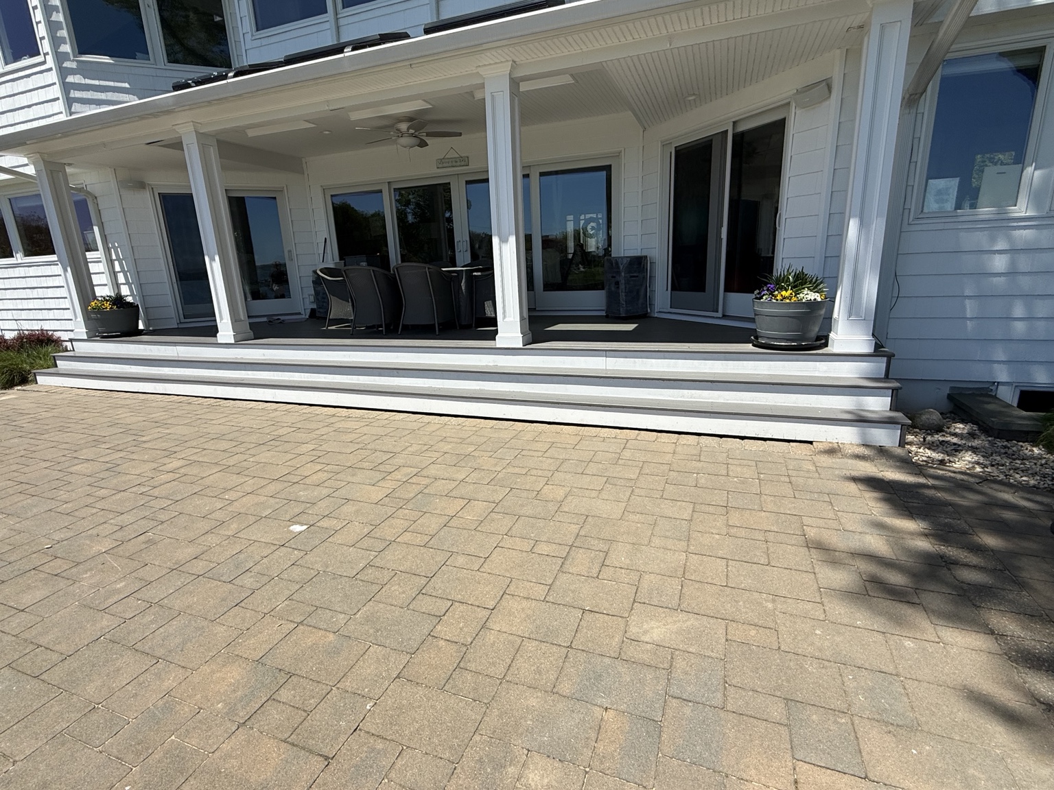 Finished porch and steps by a white house