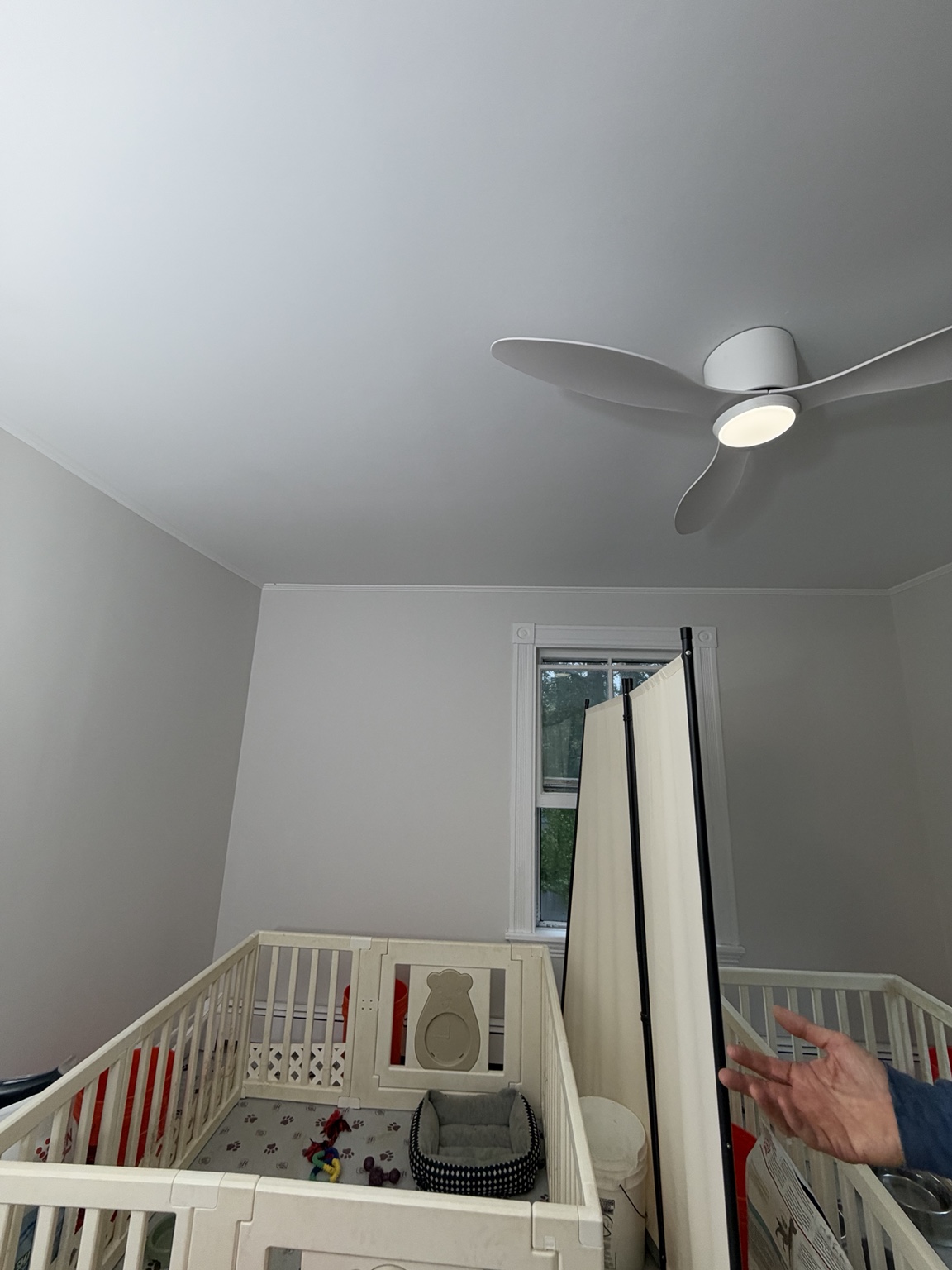Finished room with painted ceiling and fan