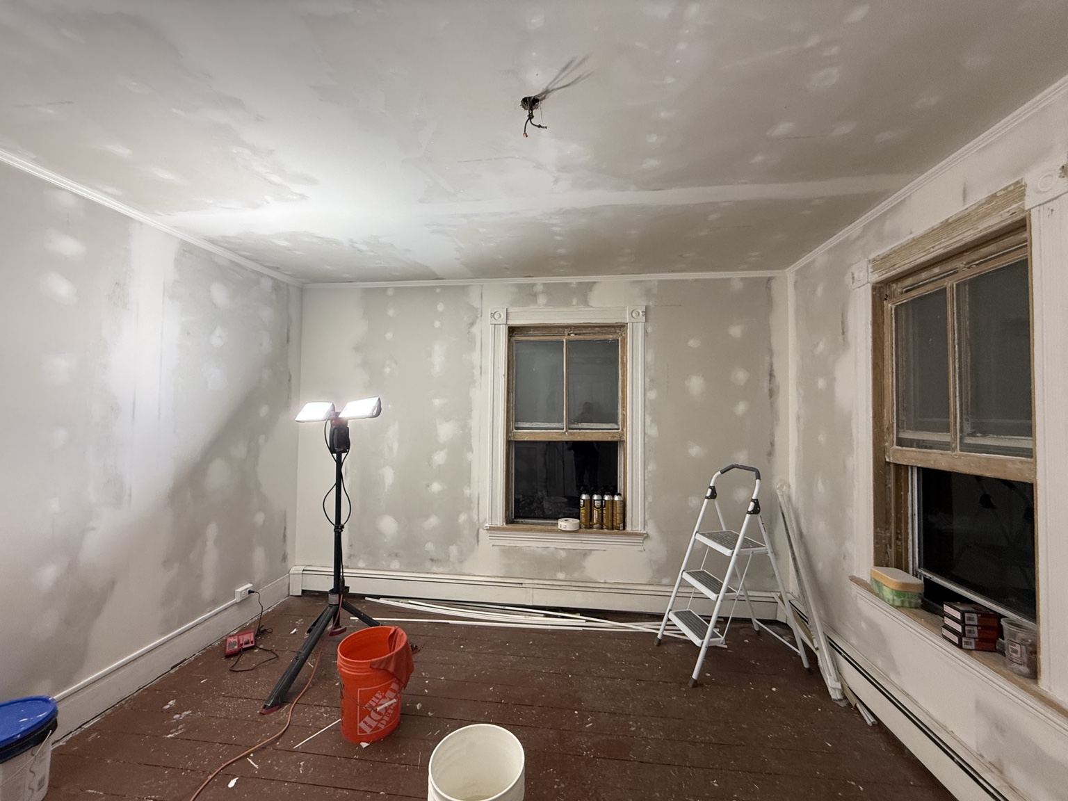 Wide interior preparation photo with ladder
